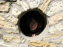 Josiah looking out a castle window